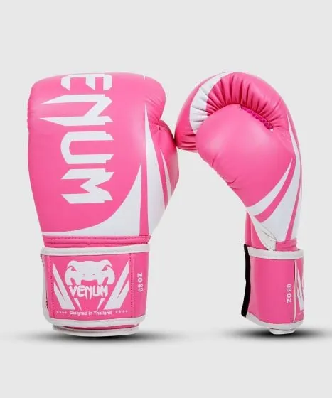 Affordable but with no concession on the quality, "Challenger 2.0" gloves are designed in Thailand and the perfect choice to begin to learn striking! Featuring a triple density foam padding, top hand protection, and a large velcro wrist strap to keep them locked in place during your training. Their Premium PU construction will bring you great fighting experience, strong durability at great price. The perfect lightweight and affordable performance boxing gloves from beginner to advanced level. Need a new pair of boxing gloves at a pretty good price? Our "Challenger 2.0" are right for you! Technical features: PU leather construction for great durability and performance Triple density foam for enhanced shock absorption and long-lasting hand protection Large Velcro enclosure with elastic for a perfectly safe customized fit Reinforced palm for increased safety with 100% attached thumb Embossed Venum Logo
